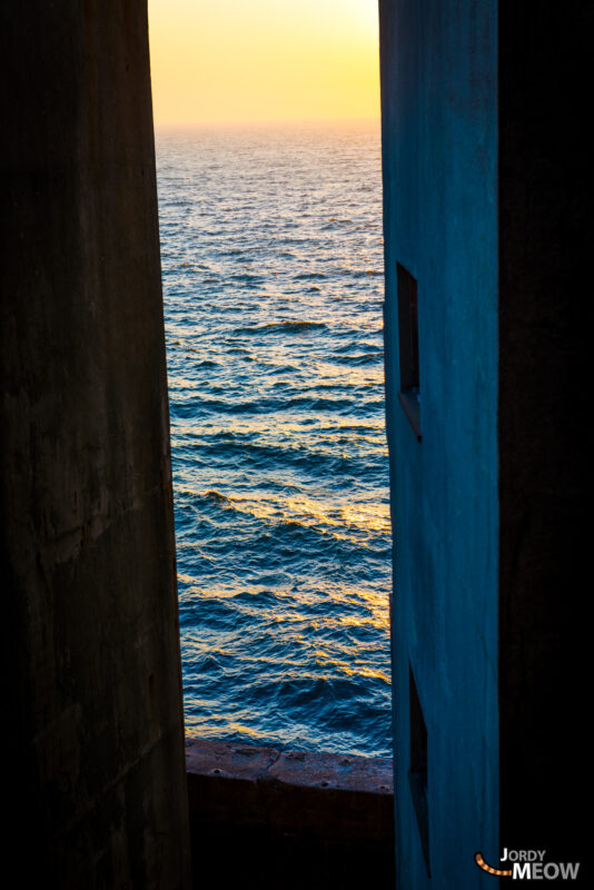 Exploring Gunkanjimas abandoned beauty with wavy ocean textures in Nagasaki, Japan.