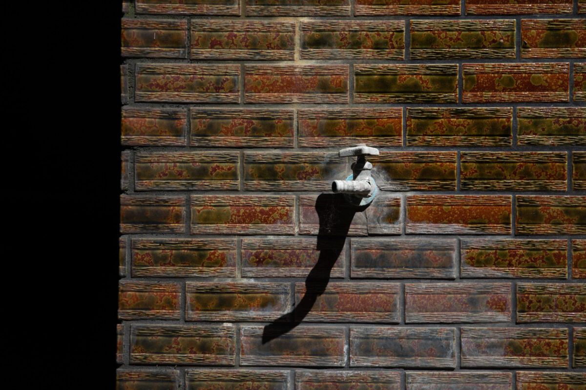 Serene silhouette in traditional Tsutsuishi Village, Japan.