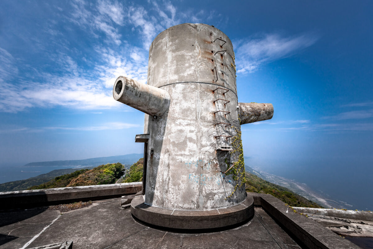 Weathered concrete observation tower at New Muroto Sky Resort mountain viewpoint under blue sky