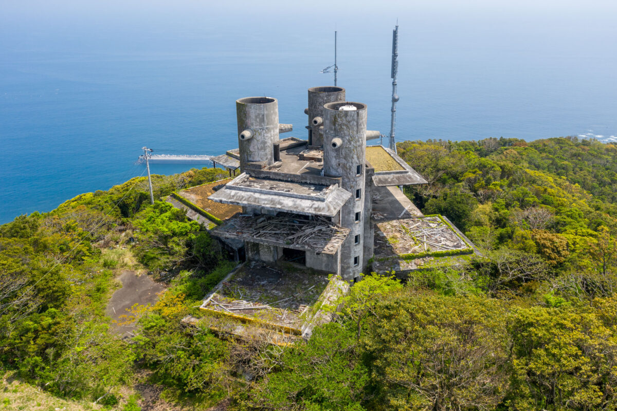Aerial view of abandoned New Muroto Sky Resort on cliff overlooking the Pacific Ocean
