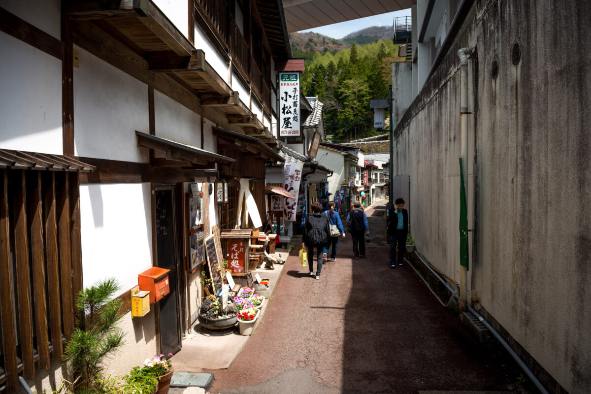 Historic alley at Sekizenkan Ryokan in Shima Onsen, Japan, with traditional wooden inns